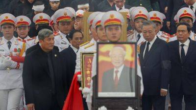Thousands pay respects as Vietnam’s ‘especially outstanding’ leader is buried