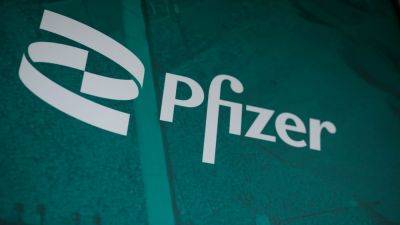 Pfizer beats earnings estimates, hikes full-year outlook as drugmaker cuts costs