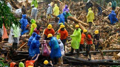 India landslides death toll passes 150 as rescuers search through mud, debris for many missing