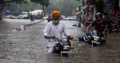 At least 11 dead after heavy rain in northern India, hundreds missing