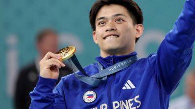 Gold medallist Carlos Yulo’s hero’s return to Manila marred by feud with mother