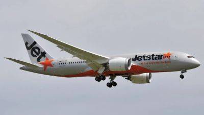 Associated Press - Jetstar passenger arrested at Melbourne airport after opening emergency exit, walking on wing - scmp.com - Australia