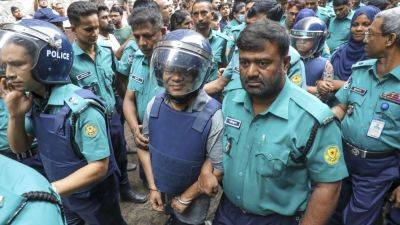 JULHAS ALAM - Bangladesh court sends 2 journalists to police custody for questioning as chaos continues - apnews.com - India - Bangladesh - Turkey - city Istanbul - city Dhaka, Bangladesh