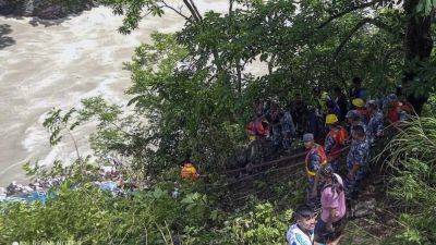 BINAJ GURUBACHARYA - 14 killed, 16 injured and more missing after a bus with Indian pilgrims drives off a Nepal highway - apnews.com - India - Nepal - city Kathmandu, Nepal