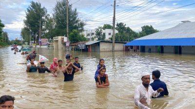 Millions in this country are stranded by flooding. Many blame their neighbor - edition.cnn.com - India - Bangladesh - city New Delhi - city Dhaka - state Tripura