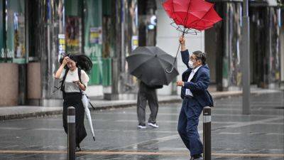 Typhoon Shanshan hits Japan, bringing heavy rain and knocking out power