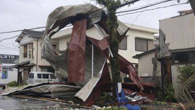 MARI YAMAGUCHI - Typhoon lashes Japan with torrential rain and strong winds on a slow crawl north - apnews.com - Japan - county Hot Spring - prefecture Kagoshima - city Tokyo - prefecture Miyazaki