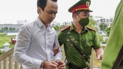 Trinh Van-Quyet - Vietnamese billionaire tycoon found guilty of defrauding stockholders, sentenced to 21 years - apnews.com - Vietnam - city Hanoi, Vietnam