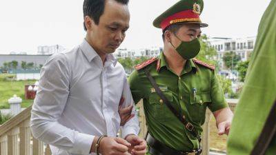 Trinh Van-Quyet - HAU DINH - Vietnamese billionaire tycoon found guilty of defrauding stockholders, sentenced to 21 years - apnews.com - Vietnam - city Hanoi, Vietnam