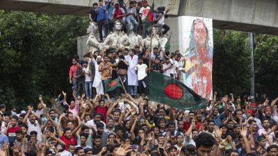 AP PHOTOS: Bangladesh protesters erupt in joy and anger as longtime prime minister steps down