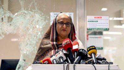 Mohammed Shahabuddin - Mujibur Rahman - Reuters - Bangladesh PM Sheikh Hasina flees, army says interim government to be formed - cnbc.com - Bangladesh - city Dhaka