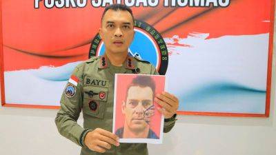 Sebby Sambom - Faizal Ramadhani - Gunmen kill New Zealand helicopter pilot in another attack in Indonesia’s restive Papua region - edition.cnn.com - New Zealand - Indonesia - Papua New Guinea - region Papua - province Papua