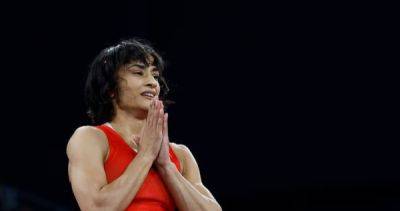 Indian wrestler Vinesh Phogat out of Paris Olympics gold medal bout for weighing 'a few grams over 50kg'