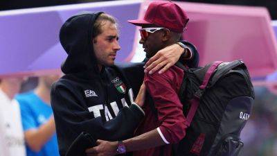 Kyle Feldscher - Olympic moment of the day: Bonded forever by Tokyo glory, Giancarlo Tamberi and Mutaz Barshim come together again - edition.cnn.com - France - Qatar - Puerto Rico - Italy - city Tokyo - city Paris