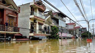 Vietnam death toll rises to 59 in Typhoon Yagi aftermath, as bridge collapses and floods sweep bus away - edition.cnn.com - Vietnam - city Hanoi - parish Red River