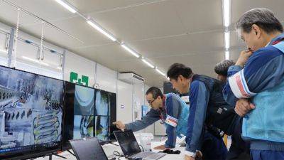 A robot resumes mission to retrieve a piece of melted fuel from inside a damaged Fukushima reactor