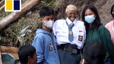 Caroline Qiqige Wang - Indonesian villagers dress up dead family members in corpse ritual - scmp.com - Indonesia