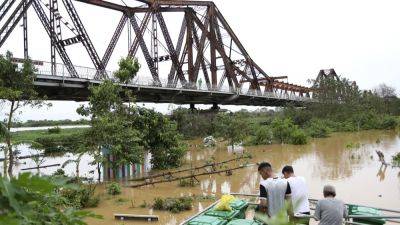 HAU DINH - Death toll from Typhoon Yagi rises to 87 in Vietnam. Dozens remain missing - apnews.com - China - Vietnam - Laos - city Hanoi, Vietnam - parish Red River