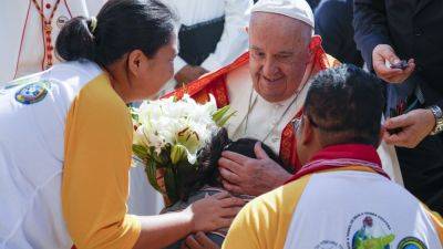 NICOLE WINFIELD - John Paul II (Ii) - Pope heads to economic power Singapore after a joyous visit to impoverished, devout East Timor - apnews.com - Indonesia - Singapore - Vatican - Spain - Timor-Leste - city Singapore - city Dili