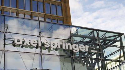 Reuters - German media empire Axel Springer to split in deal with KKR - cnbc.com - Canada - Germany