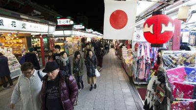 Japan's Nikkei leads gains in Asia Pacific after Wall Street soars; China holds benchmark rates