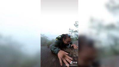 Hiker lucky to be alive after camera captures terrifying moment of falling down a mountain