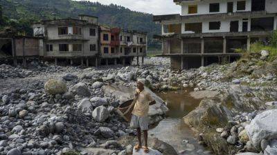 AP PHOTOS: Cascading disasters push residents of a Nepalese valley to the brink