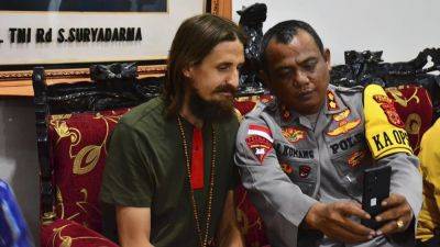 A New Zealand pilot is freed after 19 months in rebel captivity in Indonesia’s Papua region