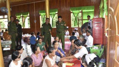 Aung Hlaing - Myanmar soldiers help clean up after a typhoon that killed more than 380 people - apnews.com - Philippines - Burma - Thailand - Vietnam - Laos