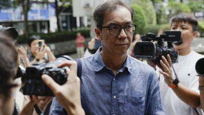 Hong Kong court sentences journalist to 21 months in jail in case seen as barometer of press freedom