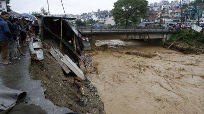 Death toll in Nepal flooding and landslides reaches at least 100, with dozens still missing