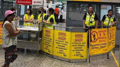 A look at Singapore’s MRT disruption and other train delays in Asia