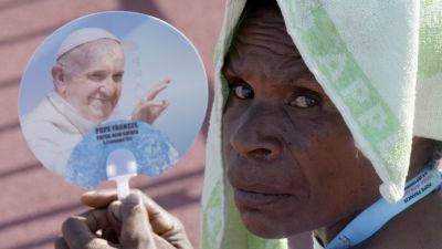 Pope brings in a ton of humanitarian aid, toys to remote Papua New Guinea as he celebrates periphery